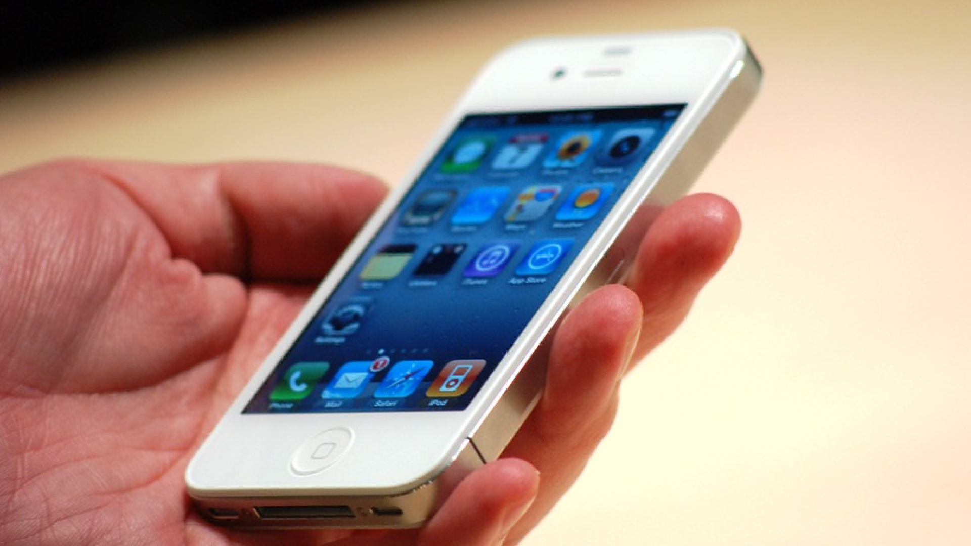 iPhone 4 in-hand, screen on