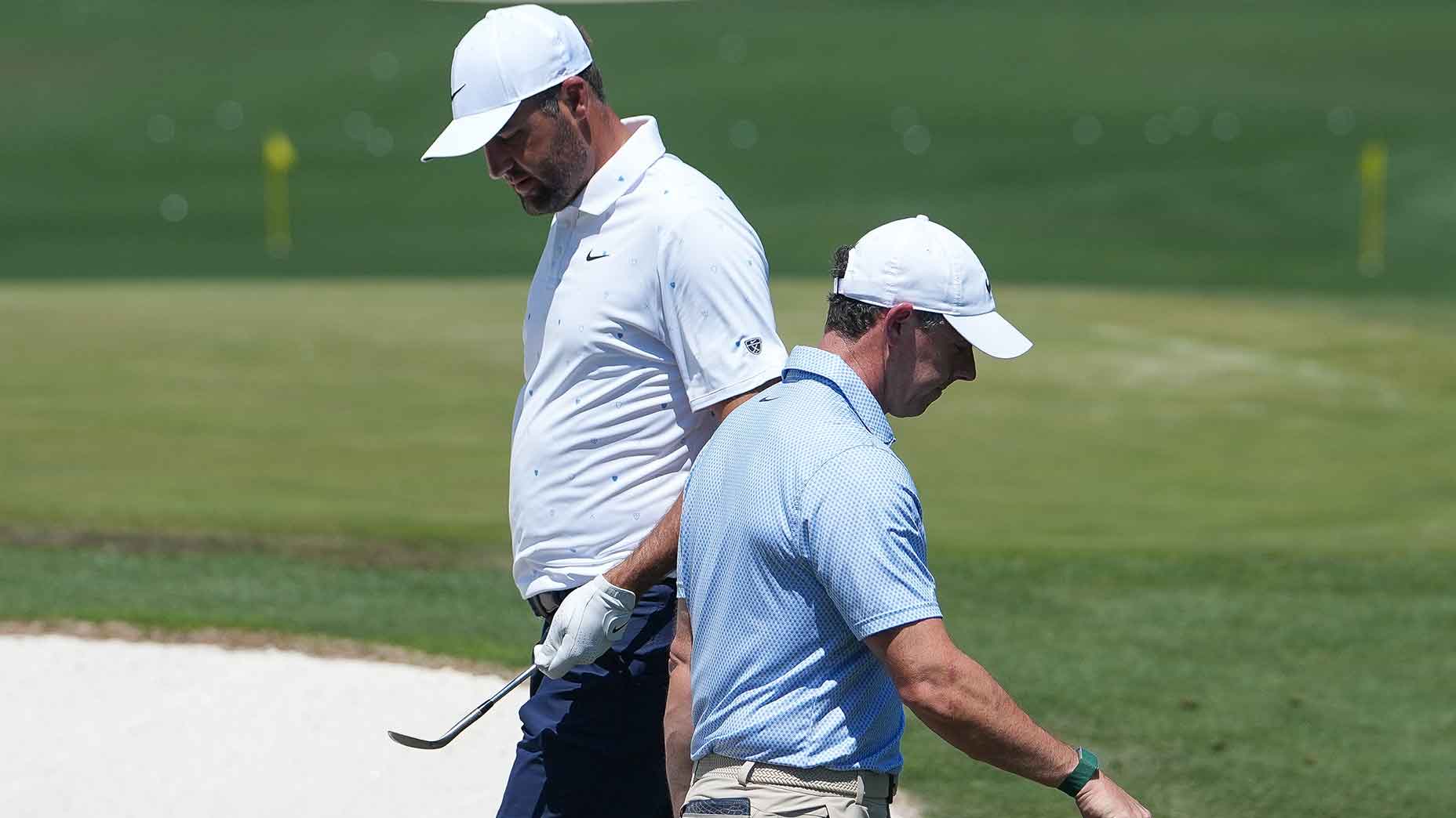 Scottie Scheffler and Rory McIlroy pass each other during the final day of the 2026 Masters.
