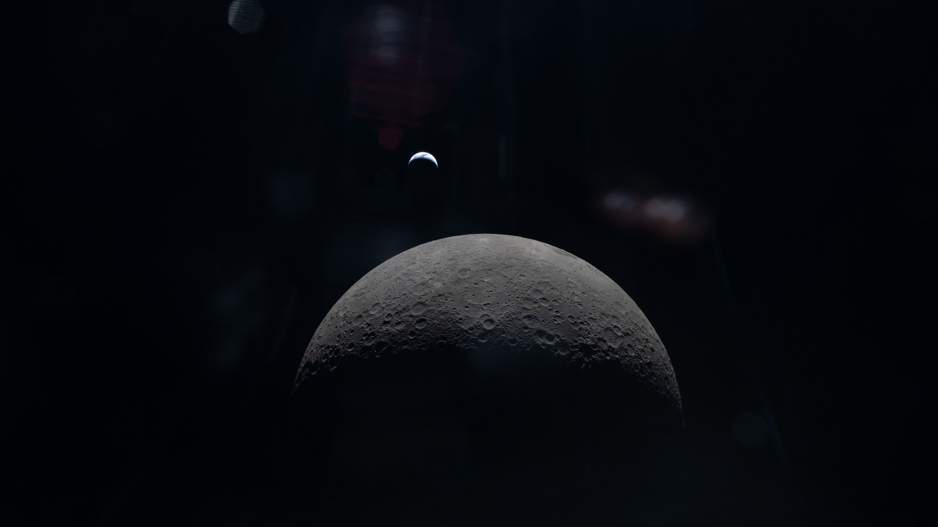 art002e015231 (April 6, 2026) &ndash; The Artemis II crew captures a faint view of a crescent Earth above the horizon on the Moon&rsquo;s far side.