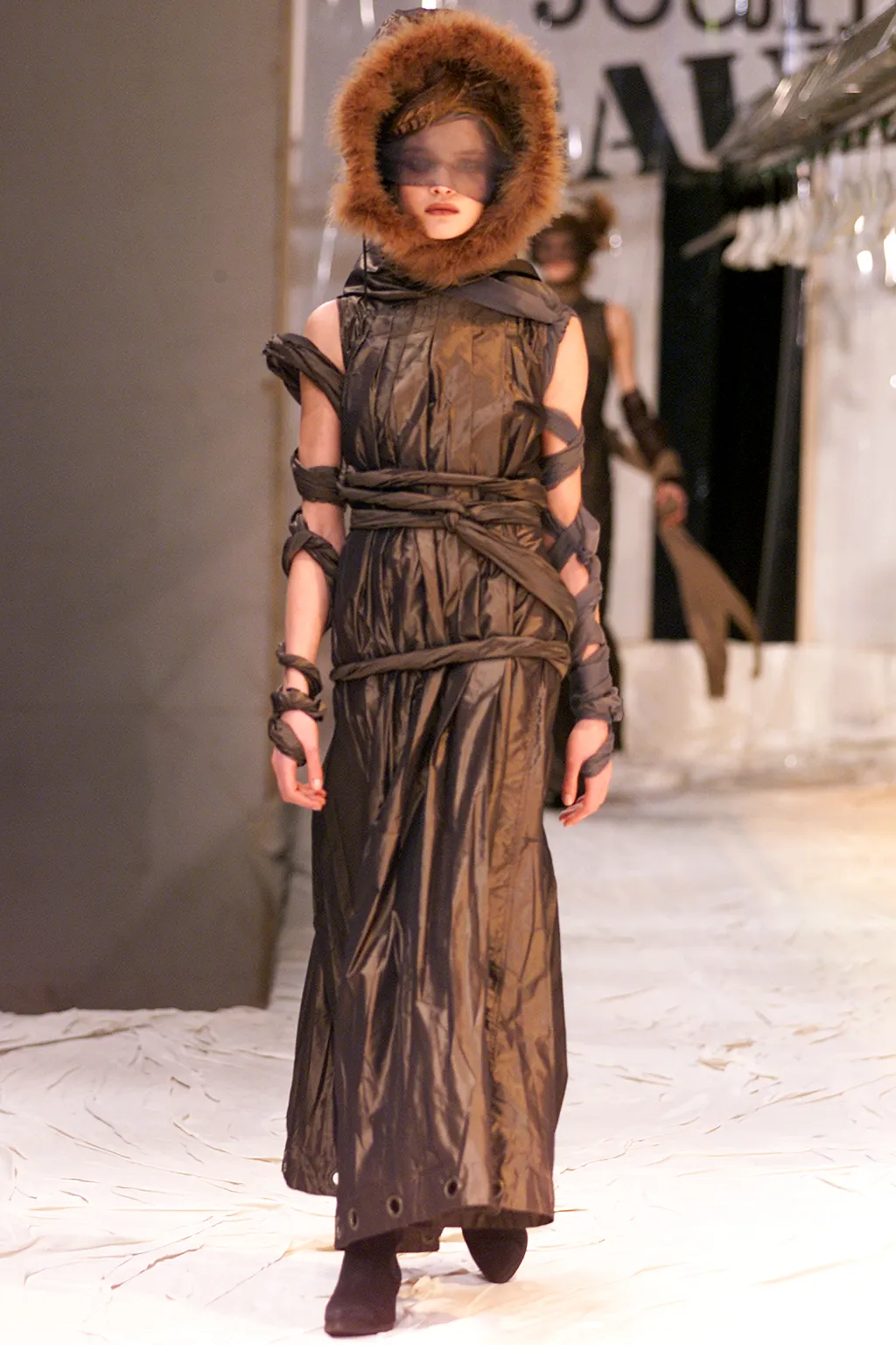 Image may contain Clothing Apparel Evening Dress Gown Robe Fashion Human Person Lily Donaldson Overcoat and Coat