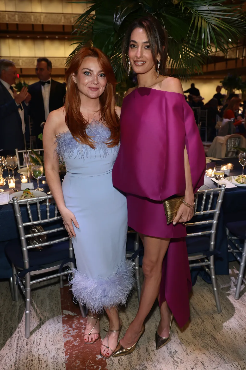 Image may contain Amal Clooney Clothing Dress Evening Dress Formal Wear Adult Person Face Head and Photography