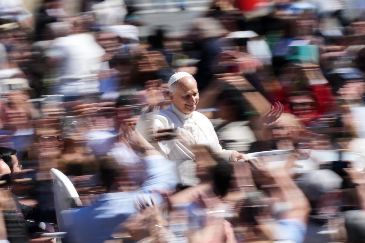 Pope Leo XIV greets the faithful at the end of Easter Mass at the Vatican, Sunday, April 5, 2026. Pope Leo XIV greets the faithful at the end of Easter Mass at the Vatican, Sunday, April 5, 2026.
