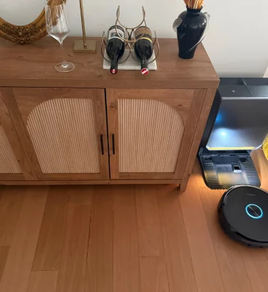Narwal Flow 2 robot vacuum returning to dock against wall