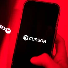 Cursor AI logo on phone screen