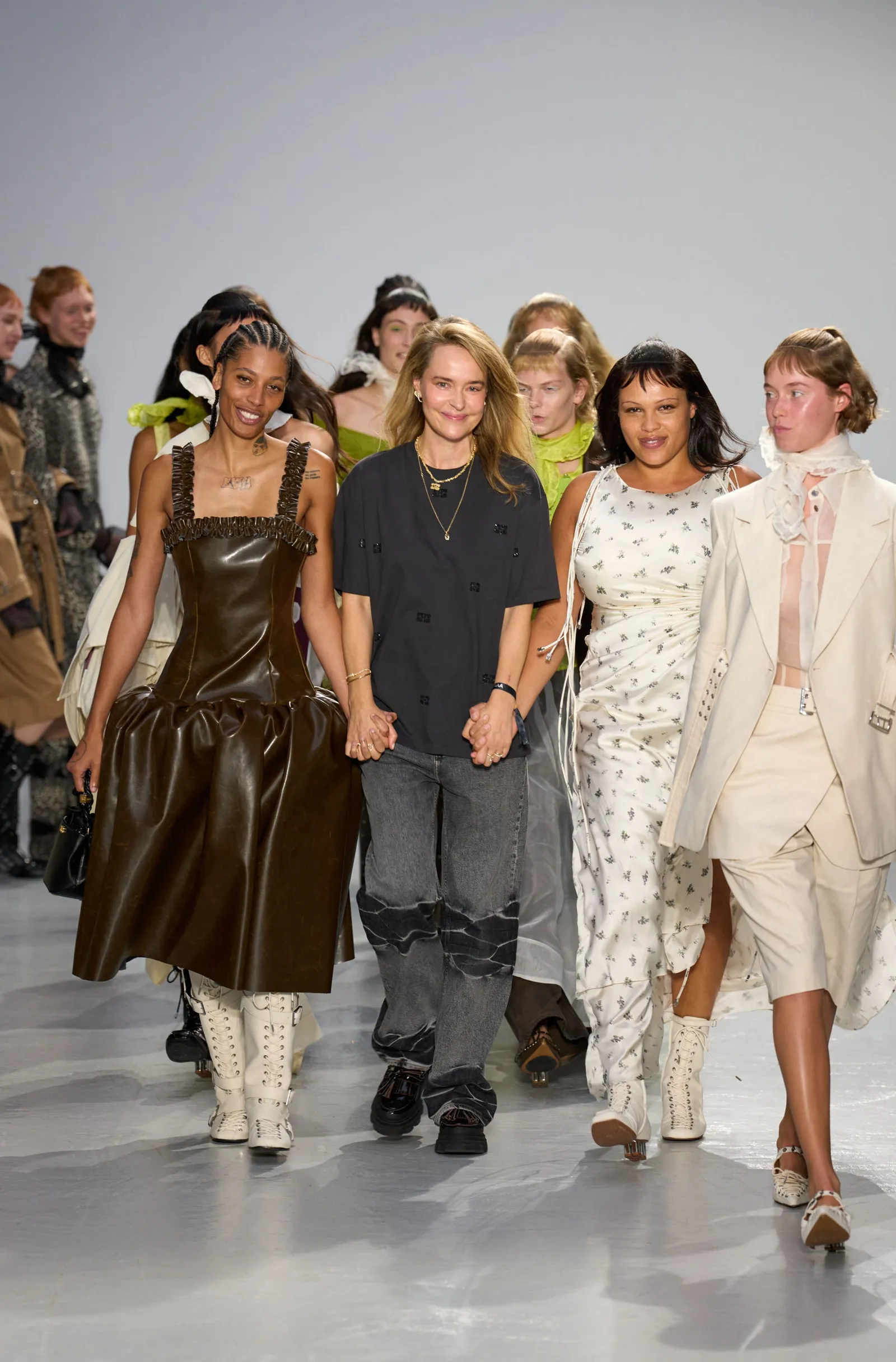 Image may contain Natalie Krill Gemma Arterton Caleb Landry Jones Adult Person Clothing Coat Dress Jeans and Pants