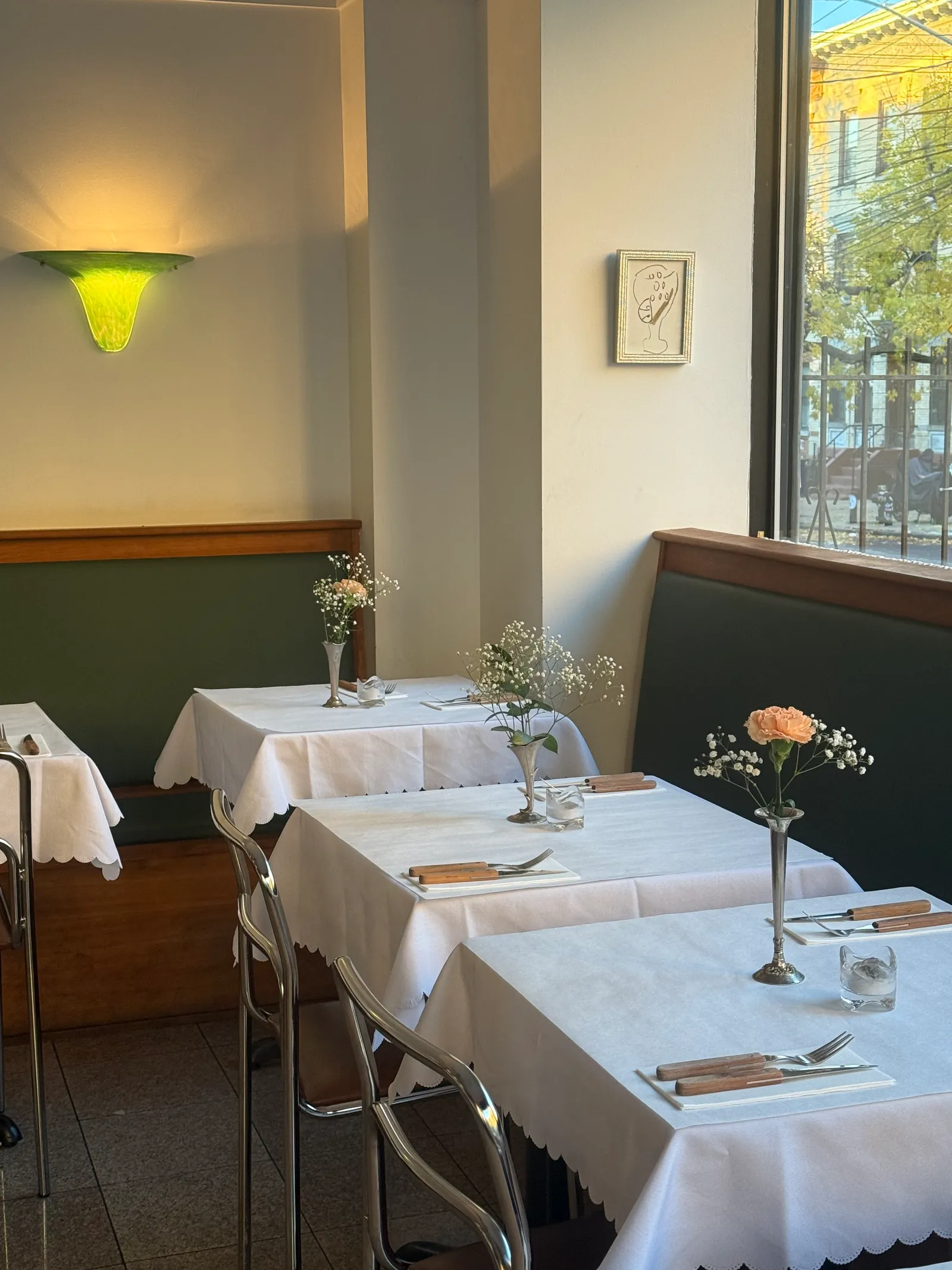 Image may contain Tablecloth Lamp Cutlery Fork Furniture Table Tabletop Cup Dining Table Blade Knife and Weapon
