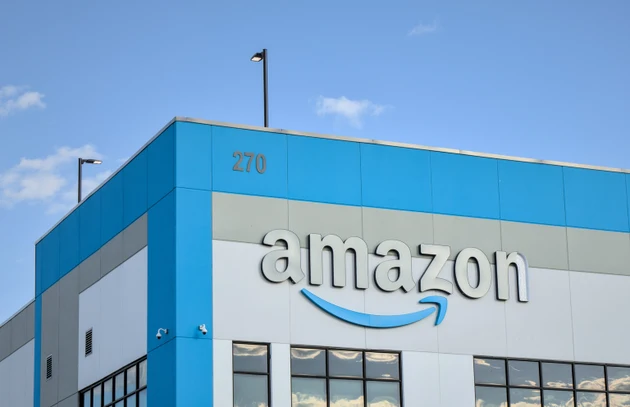 Amazon company logo with damaged letter "n" on warehouse office building in Red Hook, Brooklyn, New York City.