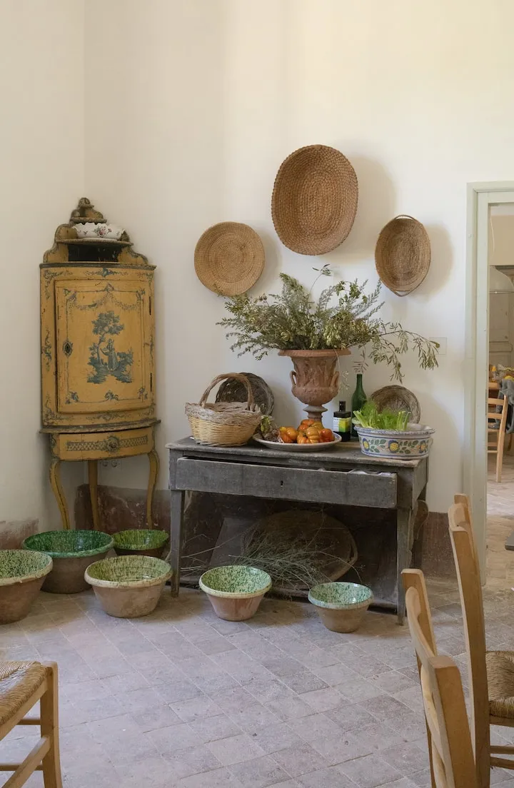 Image may contain Plant Potted Plant Indoors Interior Design Pottery Chair Furniture Plate Desk Table and Art