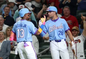 ATLANTA, GEORGIA - APRIL 10: Ronald Acuña Jr. #13 of the Atlanta Braves reacts with Matt Olson #28 after hitting a solo homer to lead off the sixth inning against the Cleveland Guardians at Truist Park on April 10, 2026 in Atlanta, Georgia. (Photo by Kevin C. Cox/Getty Images)