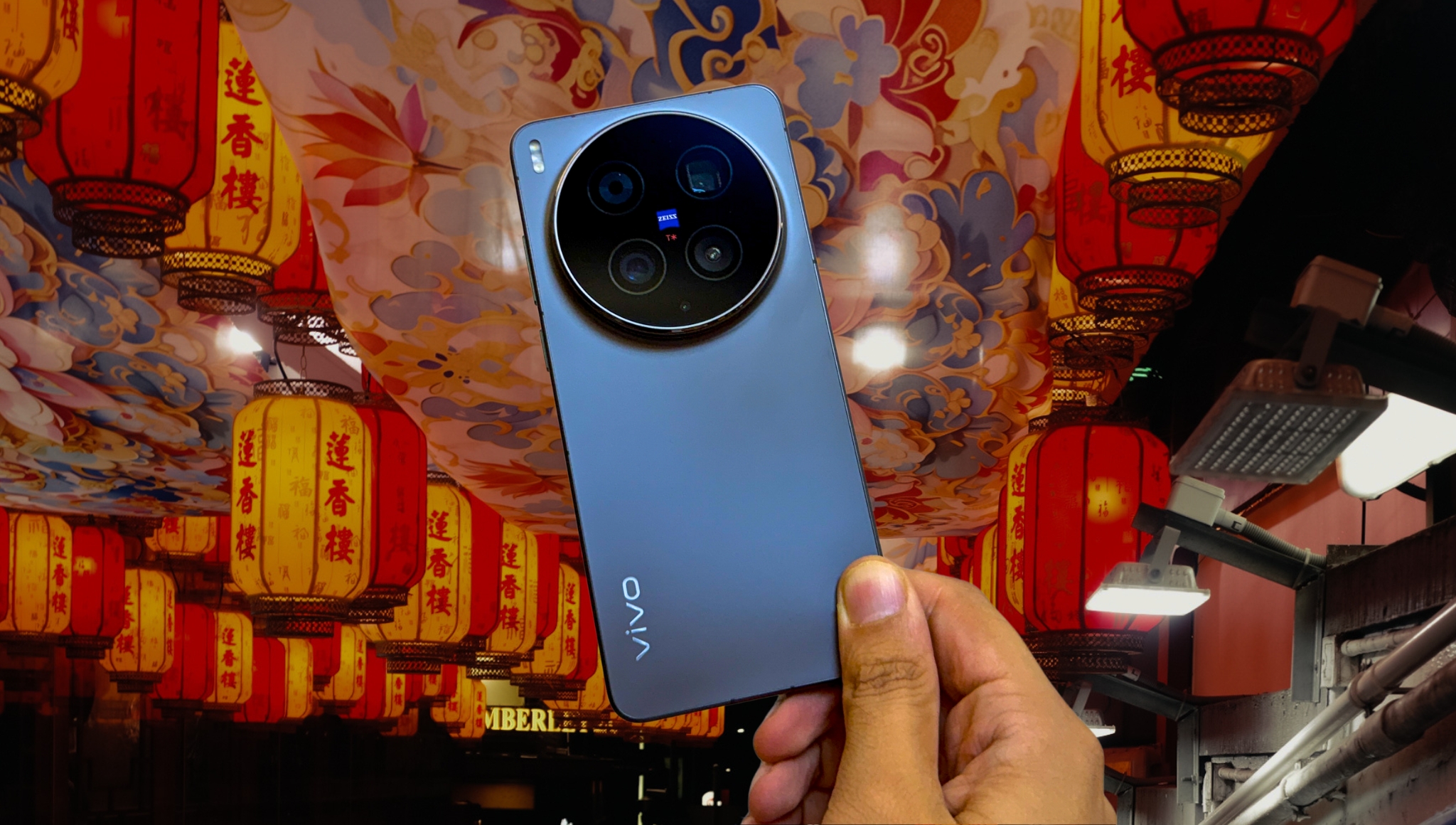 Prakhar Khanna holding the Vivo X300 Ultra against a colorful background in Hong Kong.