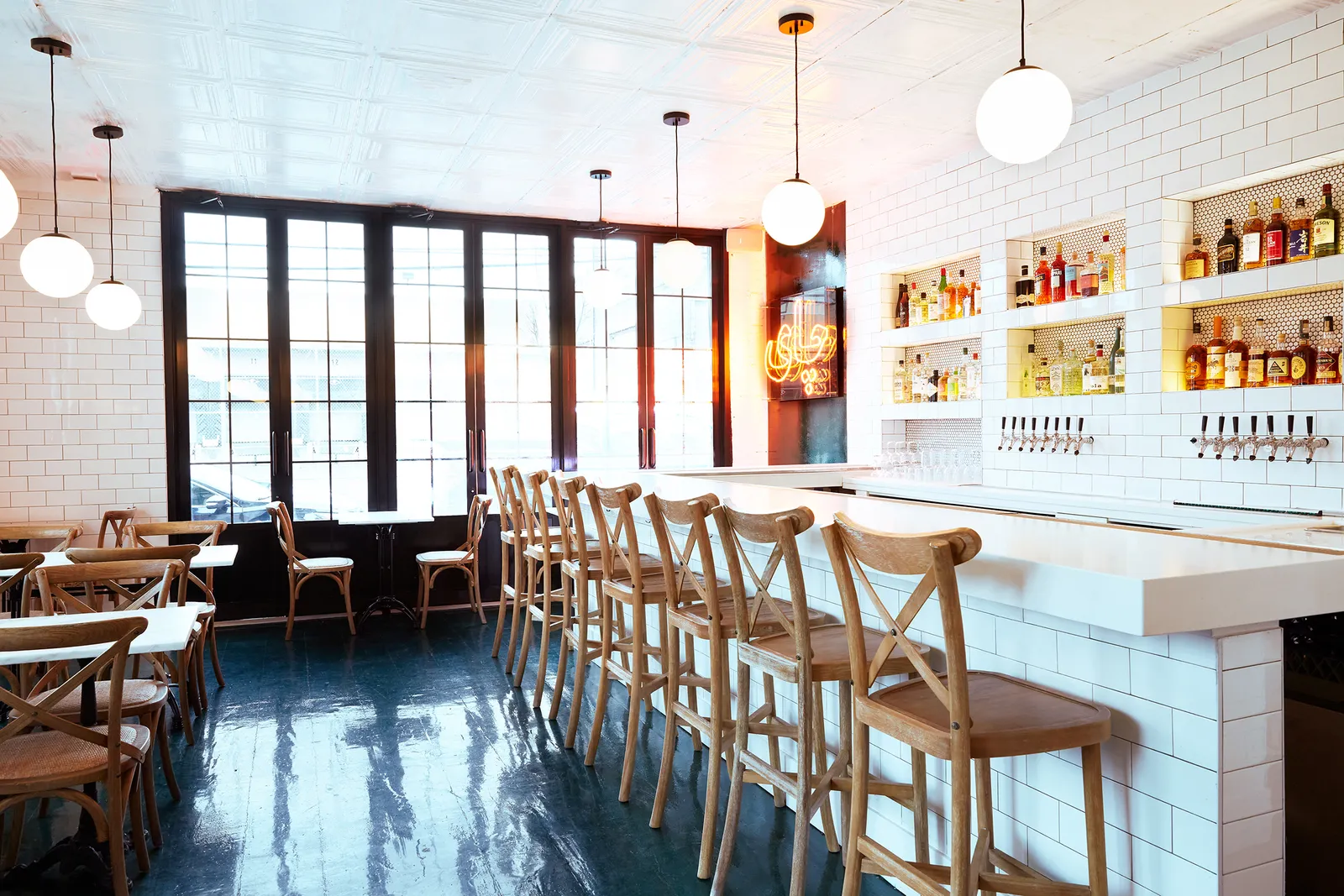 Image may contain Dining Table Furniture Table Indoors Restaurant Chair Bar and Interior Design