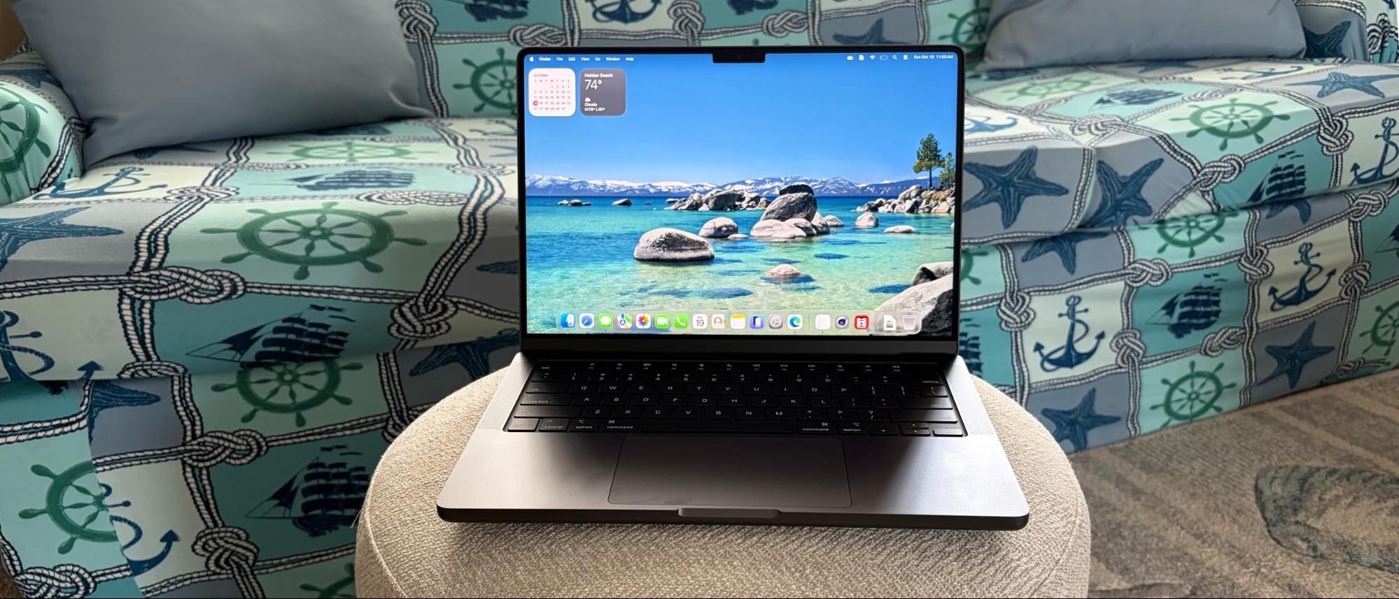 A MacBook Pro with M5 processor in a living room. Inside, it has Apple's latest M5 processor under a fan, making it a choice for those who need a more powerful Mac than the MacBook Air.