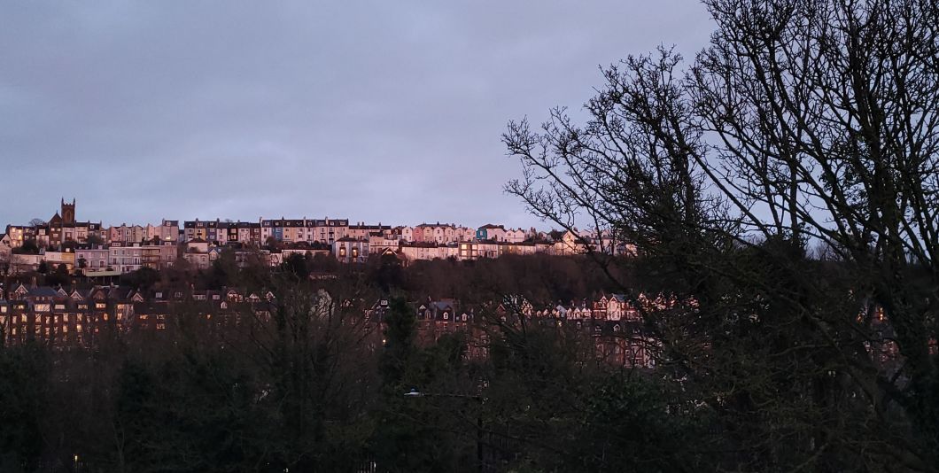 A view of Hastings West Hill on an early evening in February, as golden hour bathes the view with light