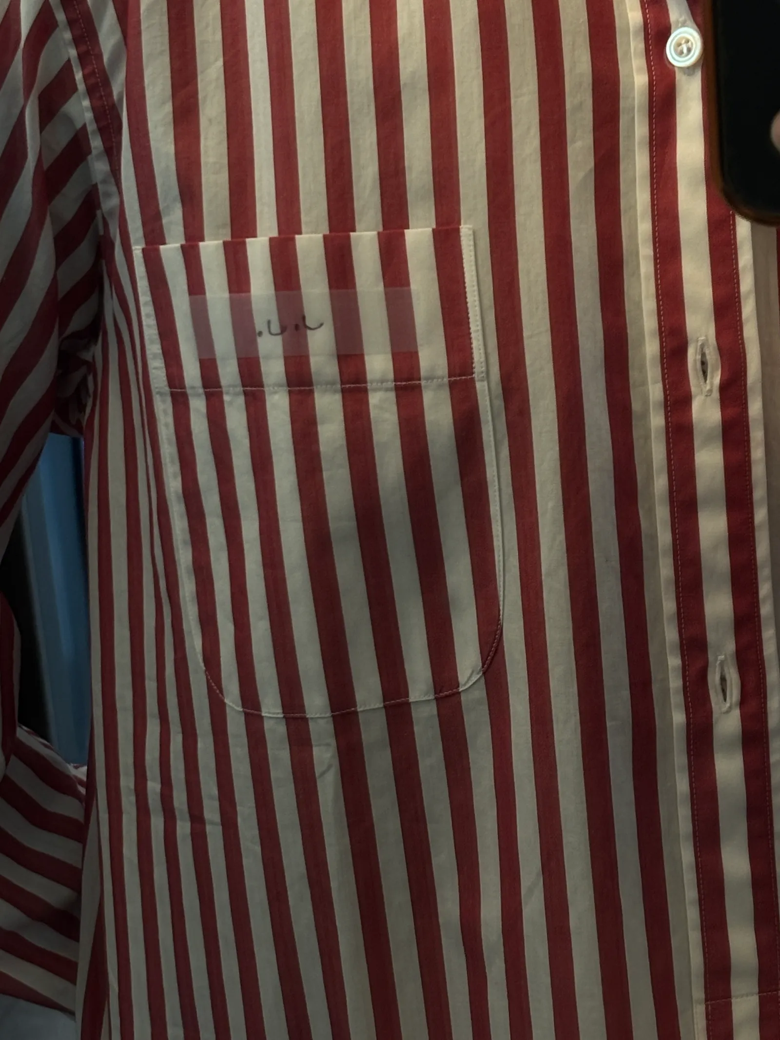 Image may contain Clothing Shirt and Apron