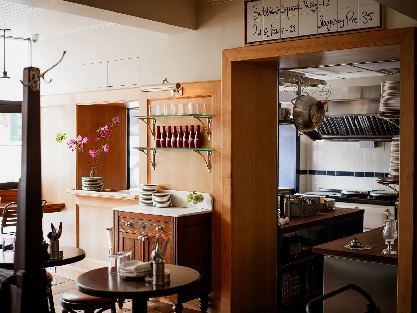 Image may contain Indoors Interior Design Shelf Kitchen Furniture Wood Closet and Cupboard