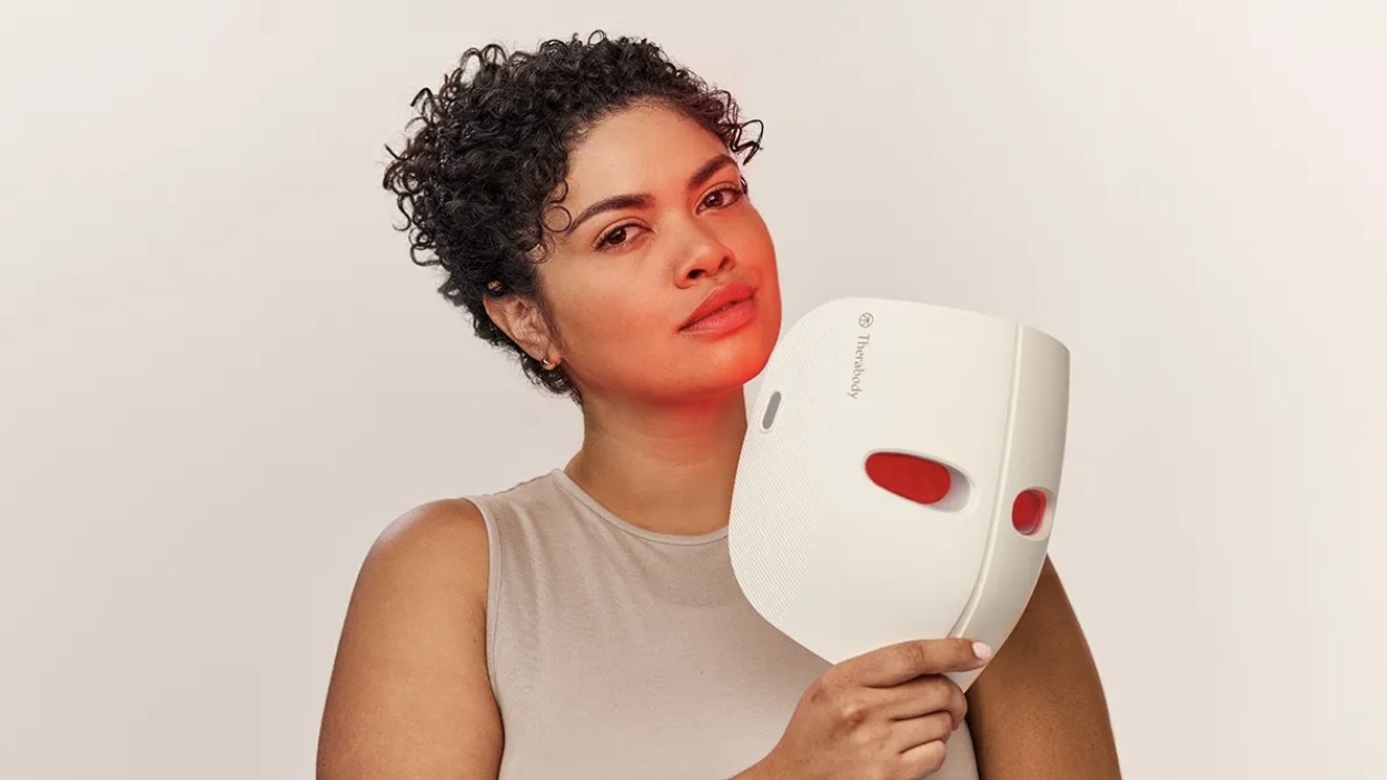 person holding theraface mask