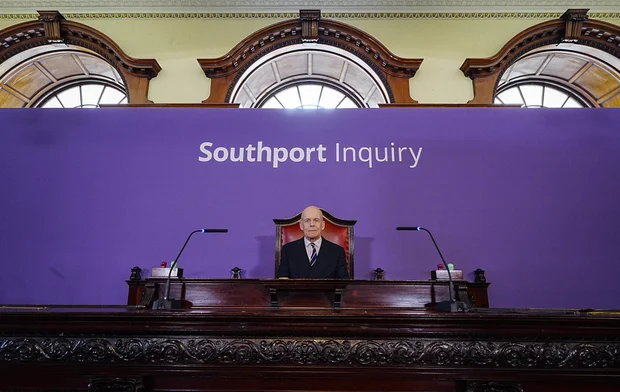 Chair Sir Adrian Fulford sits inside the hearing room ahead of the start of the inquiry into the deadly knife attack in Southport, England, July 7, 2025. 