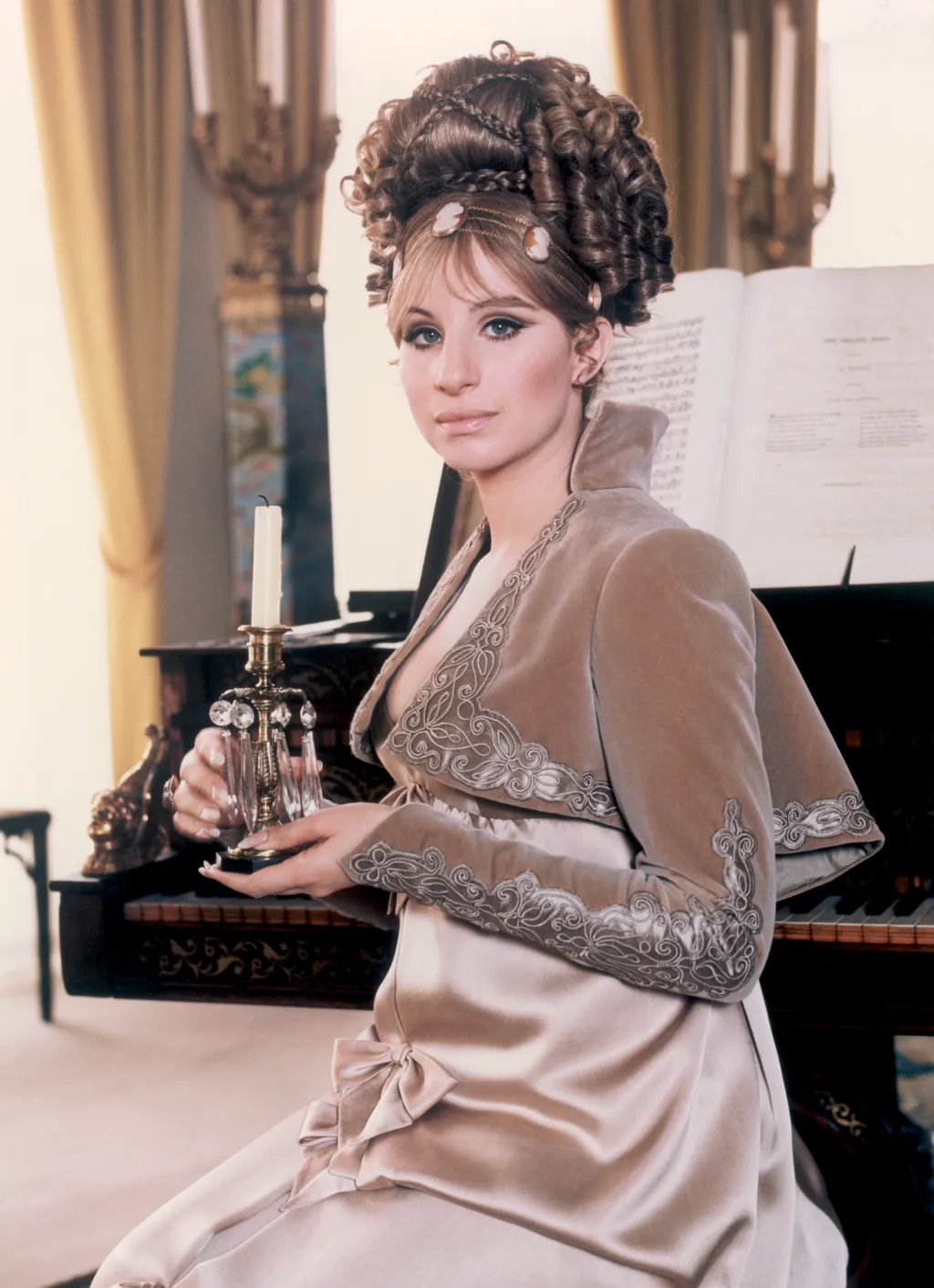 Image may contain Barbra Streisand Person Adult Clothing Dress Formal Wear Candle Face and Head