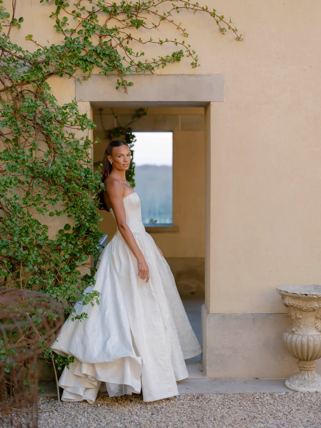 Image may contain Liz Cambage Clothing Dress Fashion Formal Wear Gown Wedding Wedding Gown Adult and Person