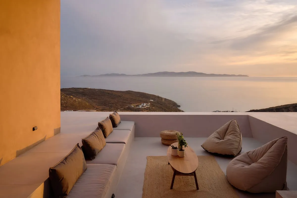 Image may contain Couch Furniture Nature Outdoors Scenery Table Architecture Balcony Building Horizon and Sky