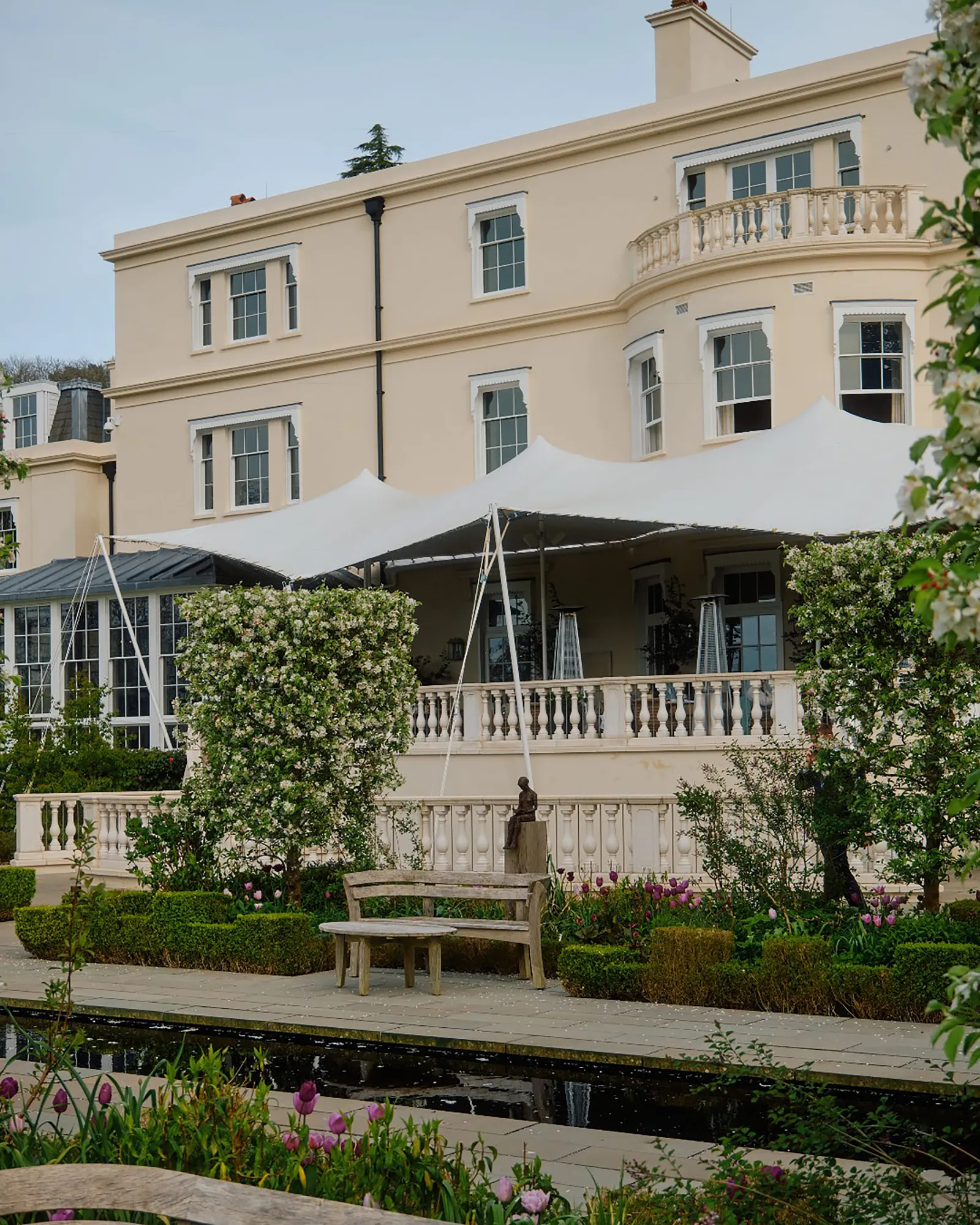 Image may contain Bench Furniture City Urban Person Nature Outdoors Yard Architecture Building Housing and Hotel
