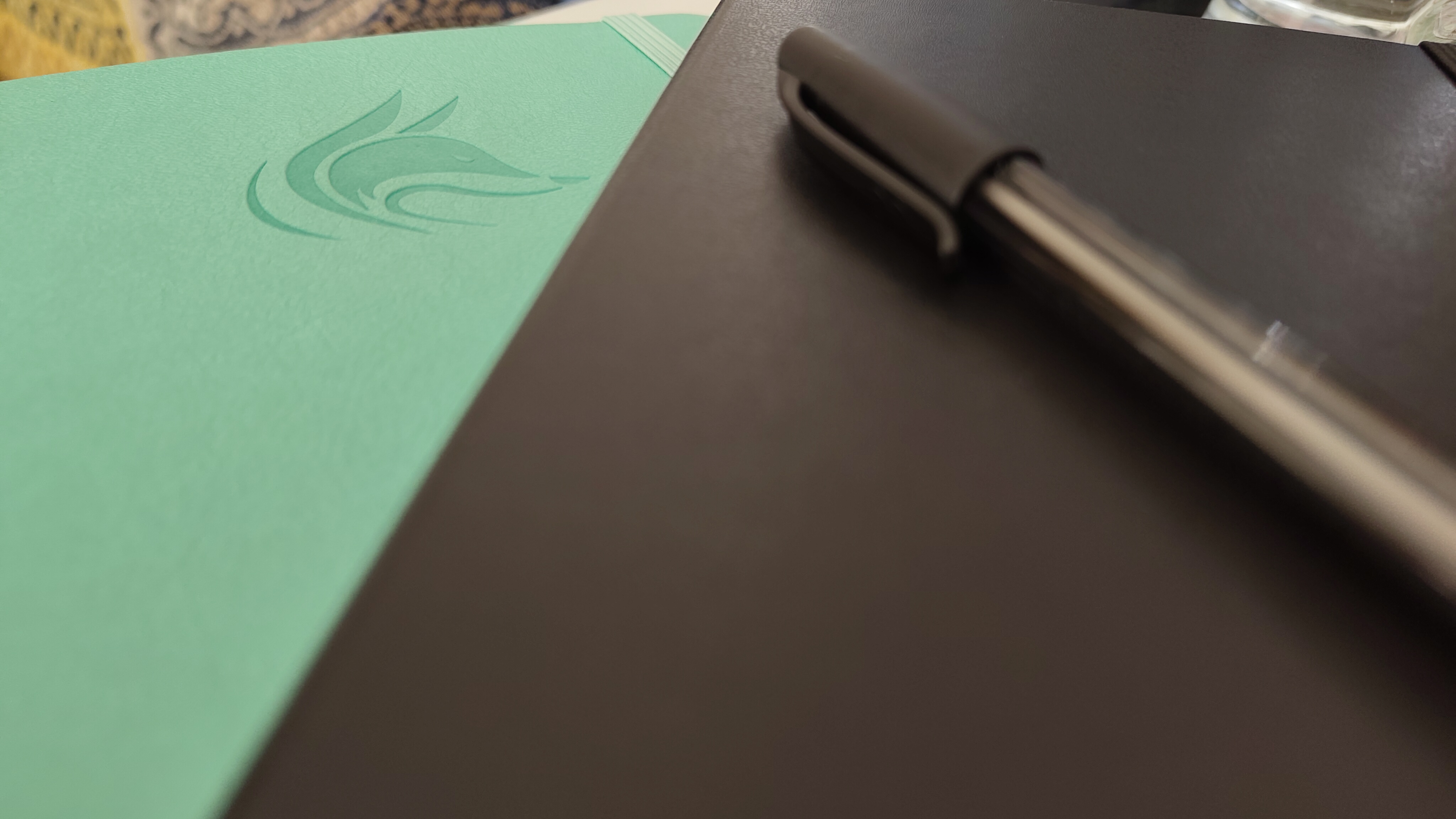 A Clever Fox planner, Moleskine notebook with a PaperMate pen on top