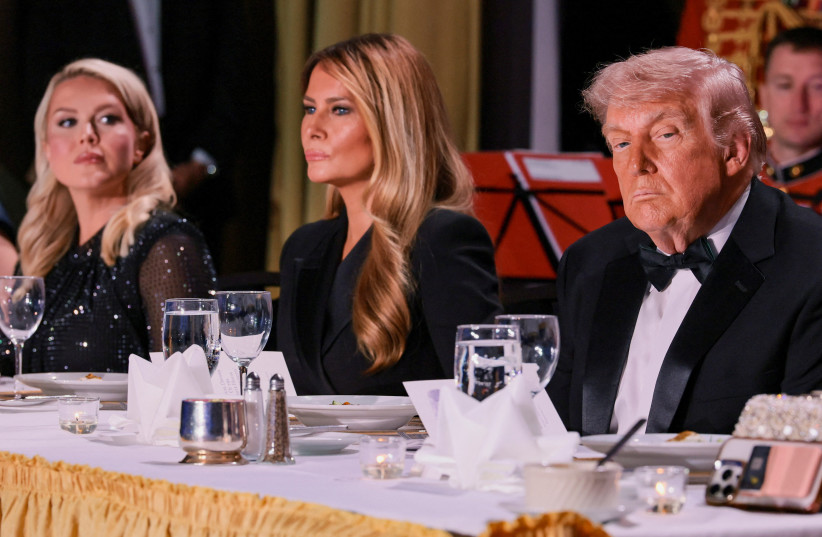 US PRESIDENT Donald Trump and first lady Melania Trump, next to White House Press Secretary Karoline Leavitt, attend the annual White House Correspondents' Association dinner in Washington, DC, US, April 25, 2026.