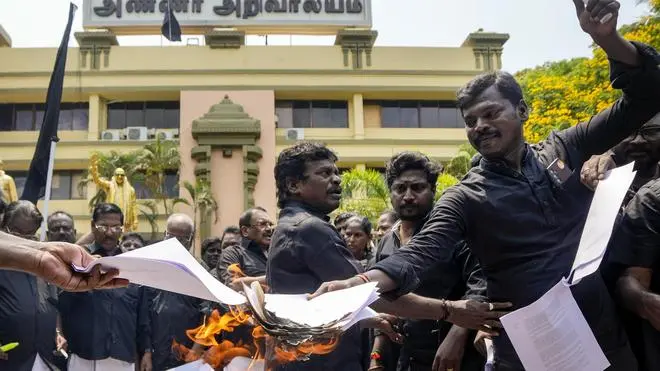 DMK workers burn copies of the proposed delimitation Bill during a protest at the party office, in Chennai, on April 16, 2026. DMK workers burn copies of the proposed delimitation Bill during a protest at the party office, in Chennai, on April 16, 2026.