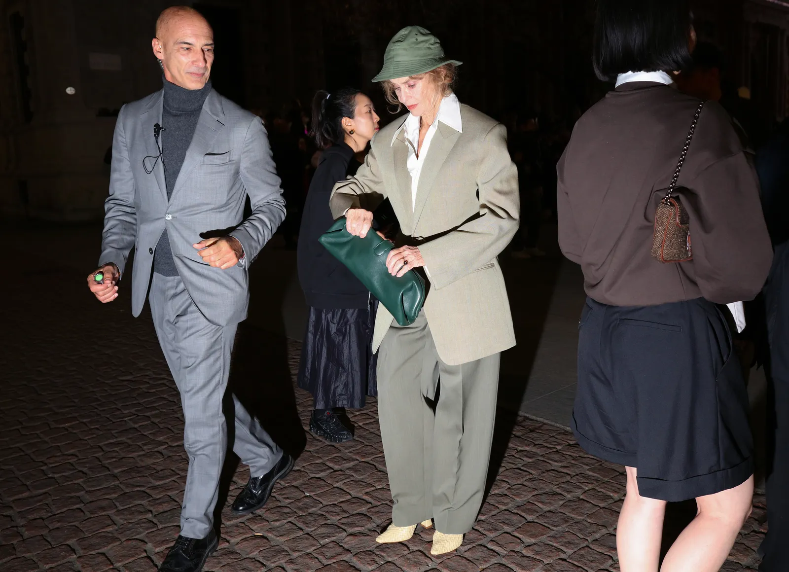 Image may contain Lauren Hutton Person Adult Clothing Coat Accessories Bag Handbag Footwear Shoe and Formal Wear