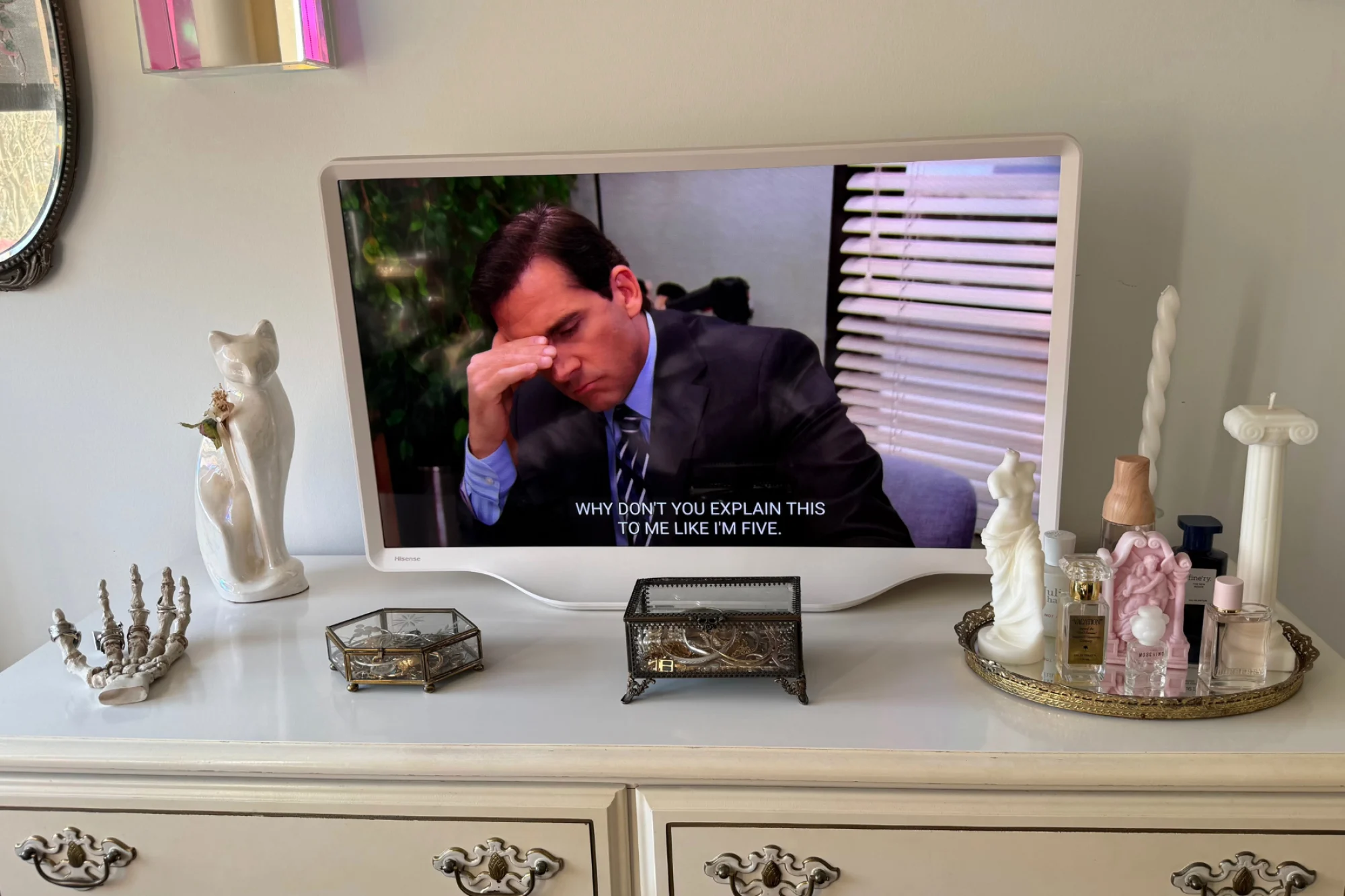 Hisense Déco TV sitting on dresser while playing a scene from "The Office"
