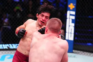 LAS VEGAS, NEVADA - OCTOBER 07: Adrian Luna Martinetti of Ecuador punches Mark Vologdin of Russia in a bantamweight fight during Dana White's Contender Series season nine, week nine at UFC APEX on October 07, 2025 in Las Vegas, Nevada. (Photo by Chris Unger/Zuffa LLC)