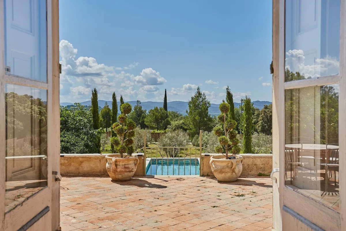 Image may contain Architecture Building House Housing Villa Plant Potted Plant Nature Outdoors Scenery and Pool