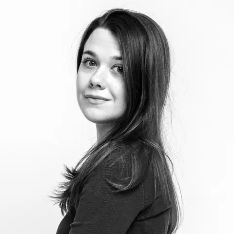 A black and white profil…g woman with long hair.