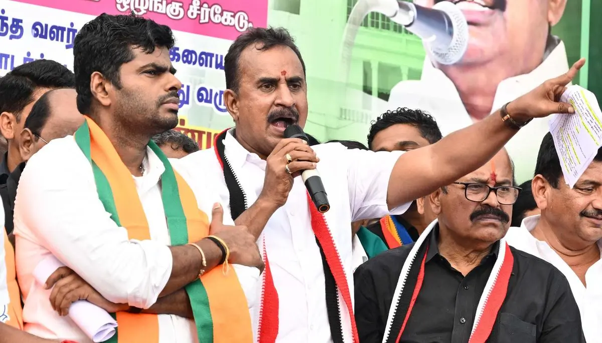 AIADMK leader S.P. Velumani (centre) and former BJP State president K. Annamalai at a protest meeting against the DMK government in Coimbatore on March 17. AIADMK leader S.P. Velumani (centre) and former BJP State president K. Annamalai at a protest meeting against the DMK government in Coimbatore on March 17.