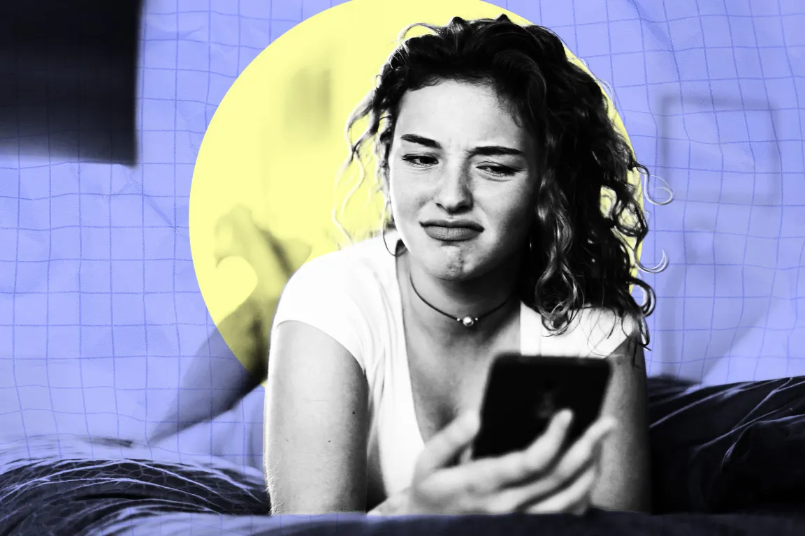 A young woman with curly hair is lying down and holding a smartphone. She has a displeased or disgusted expression on her face. She is wearing a white shirt and a choker necklace with a small pendant. The background features a yellow circle behind her head and a blue grid pattern.