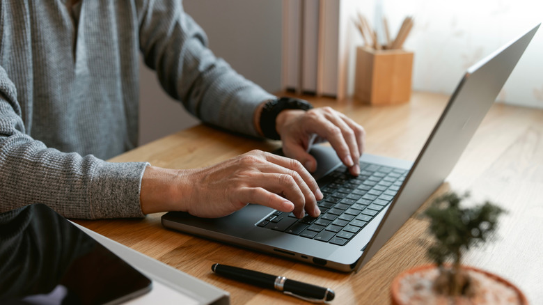 Person working on a laptop