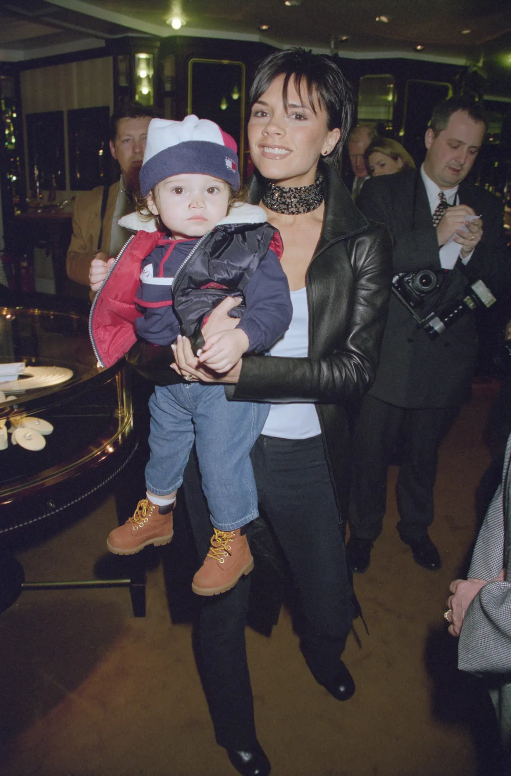 Image may contain Victoria Beckham Giorgi Marghvilashvili Sergei Nakariakov Clothing Coat Jacket Pants and Footwear....