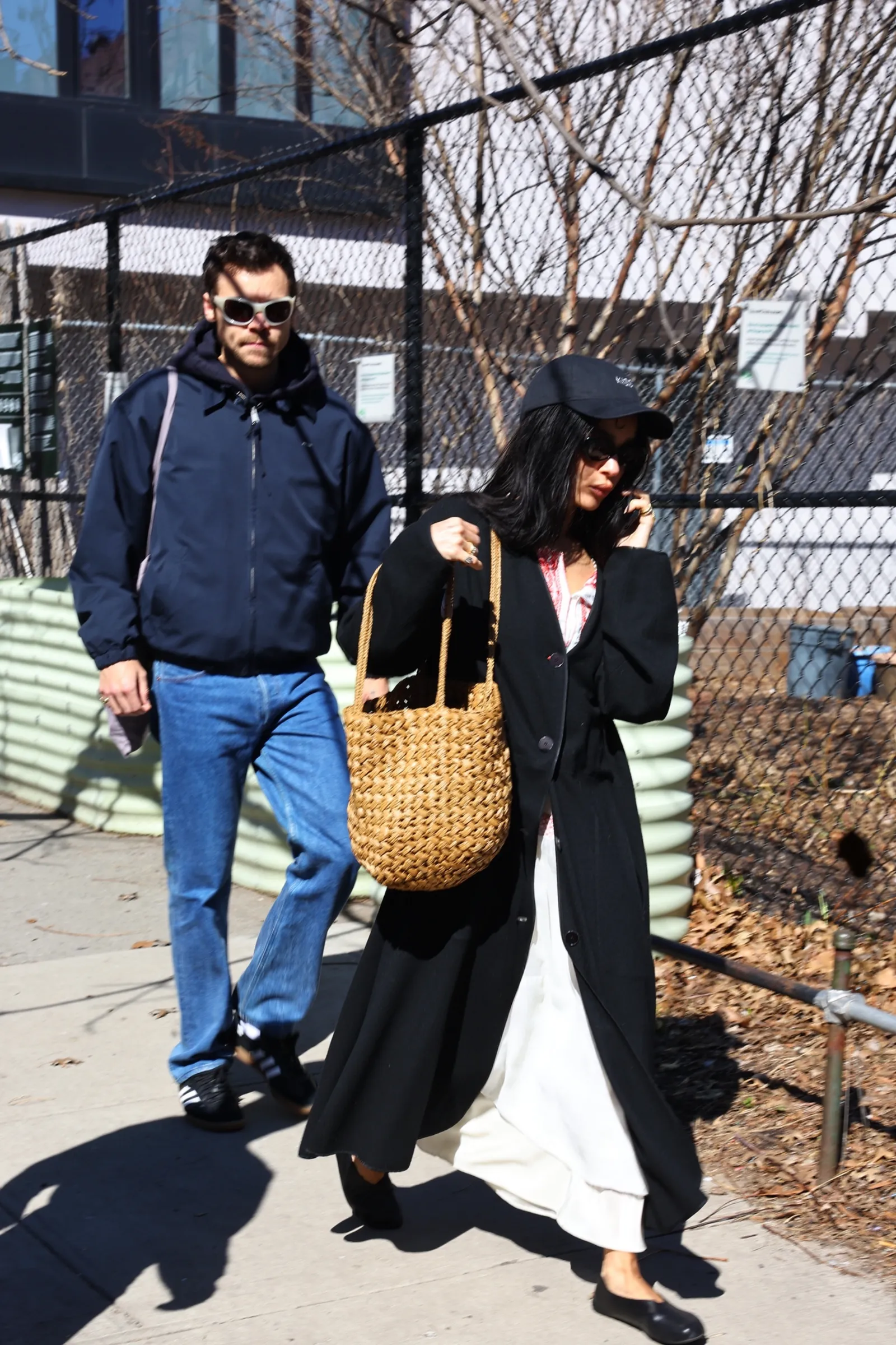 Image may contain Harry Styles Zoë Kravitz Clothing Pants Coat Jacket Blazer Accessories Bag Handbag and Person