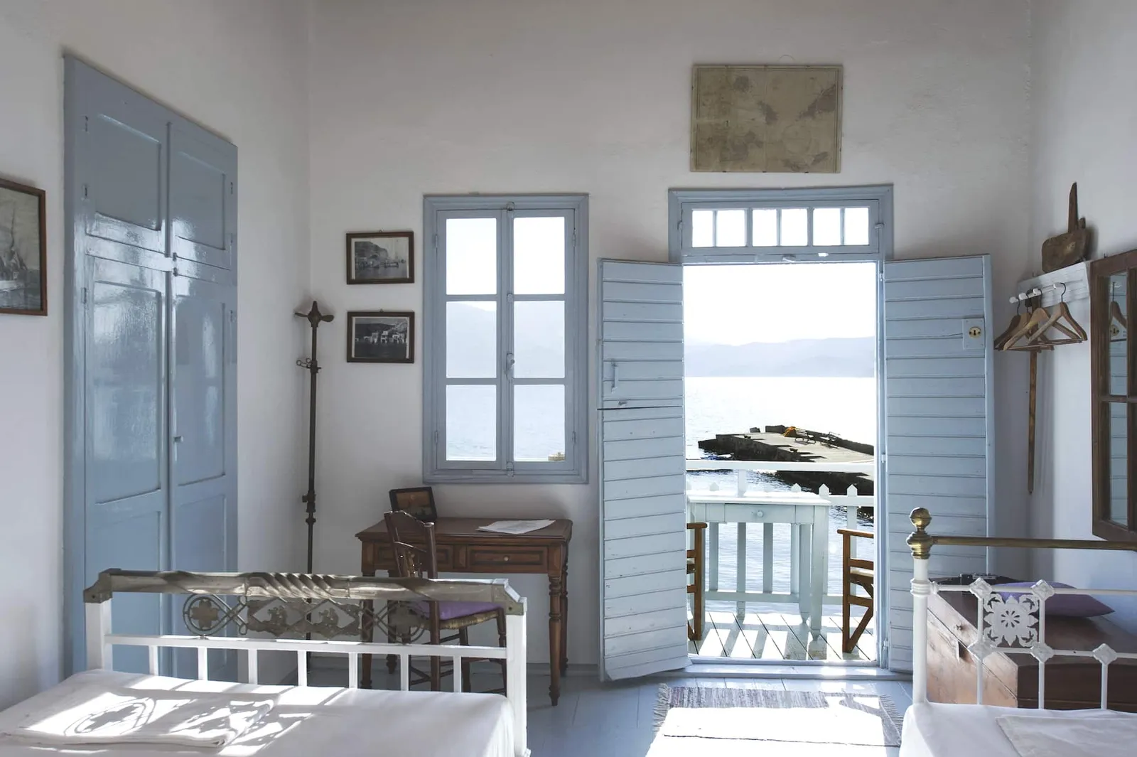 Image may contain Chair Furniture Desk Table Indoors Interior Design Art Painting Architecture and Balcony