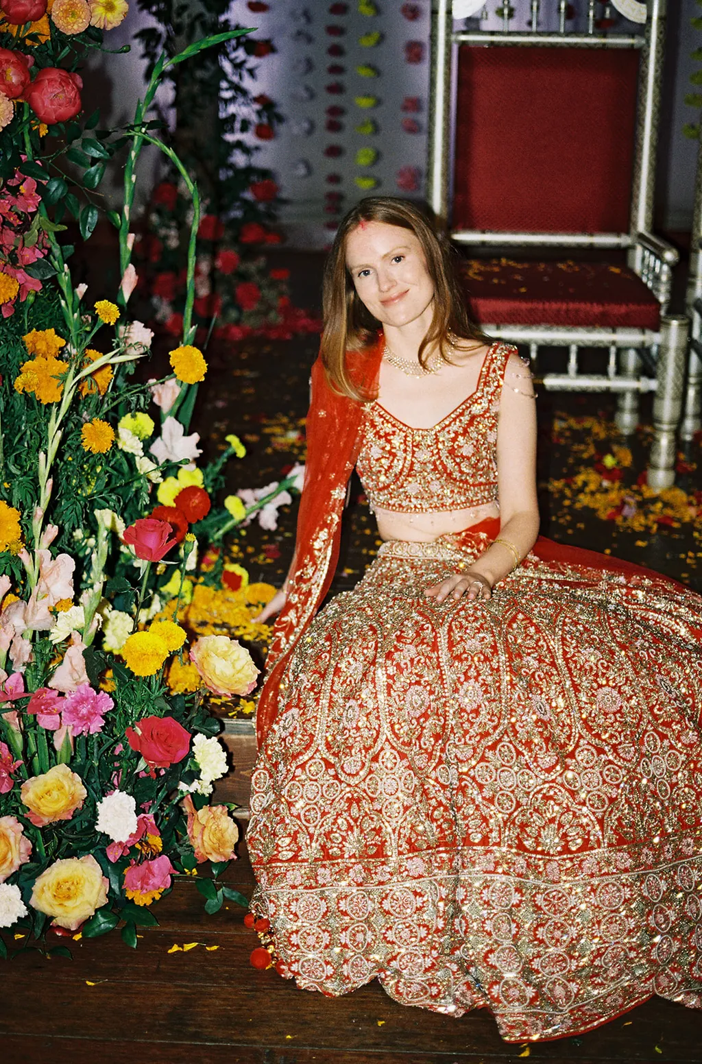 Image may contain Sarah Kendall Clothing Dress Fashion Formal Wear Gown Wedding Wedding Gown Person and Flower
