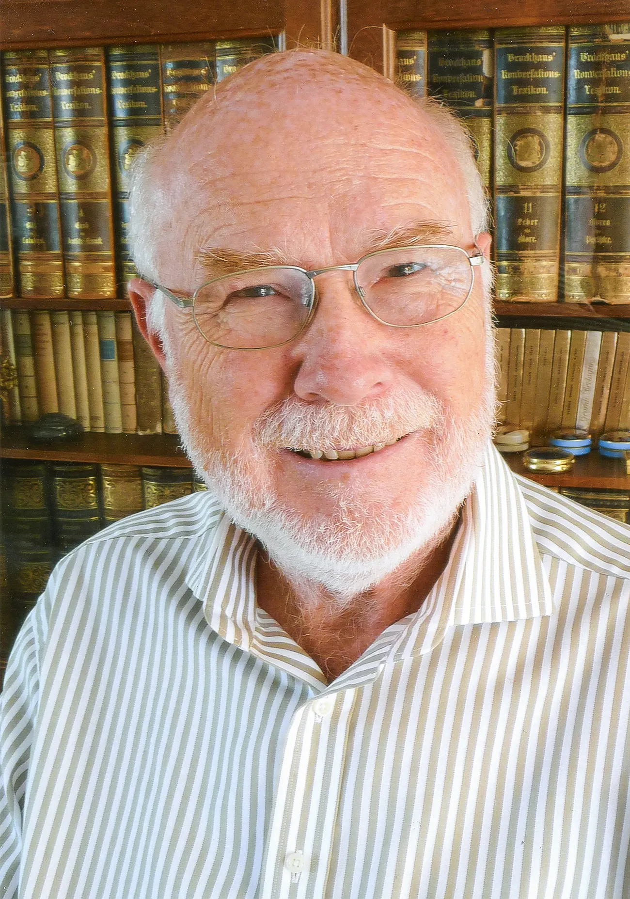 Image may contain Dave Hunt Face Head Person Photography Portrait Book Indoors Library Publication and Adult