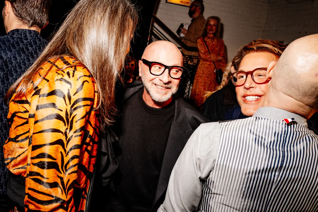 Image may contain Domenico Dolce Accessories Glasses Person Photobombing Adult Clothing Coat Face Head and Urban