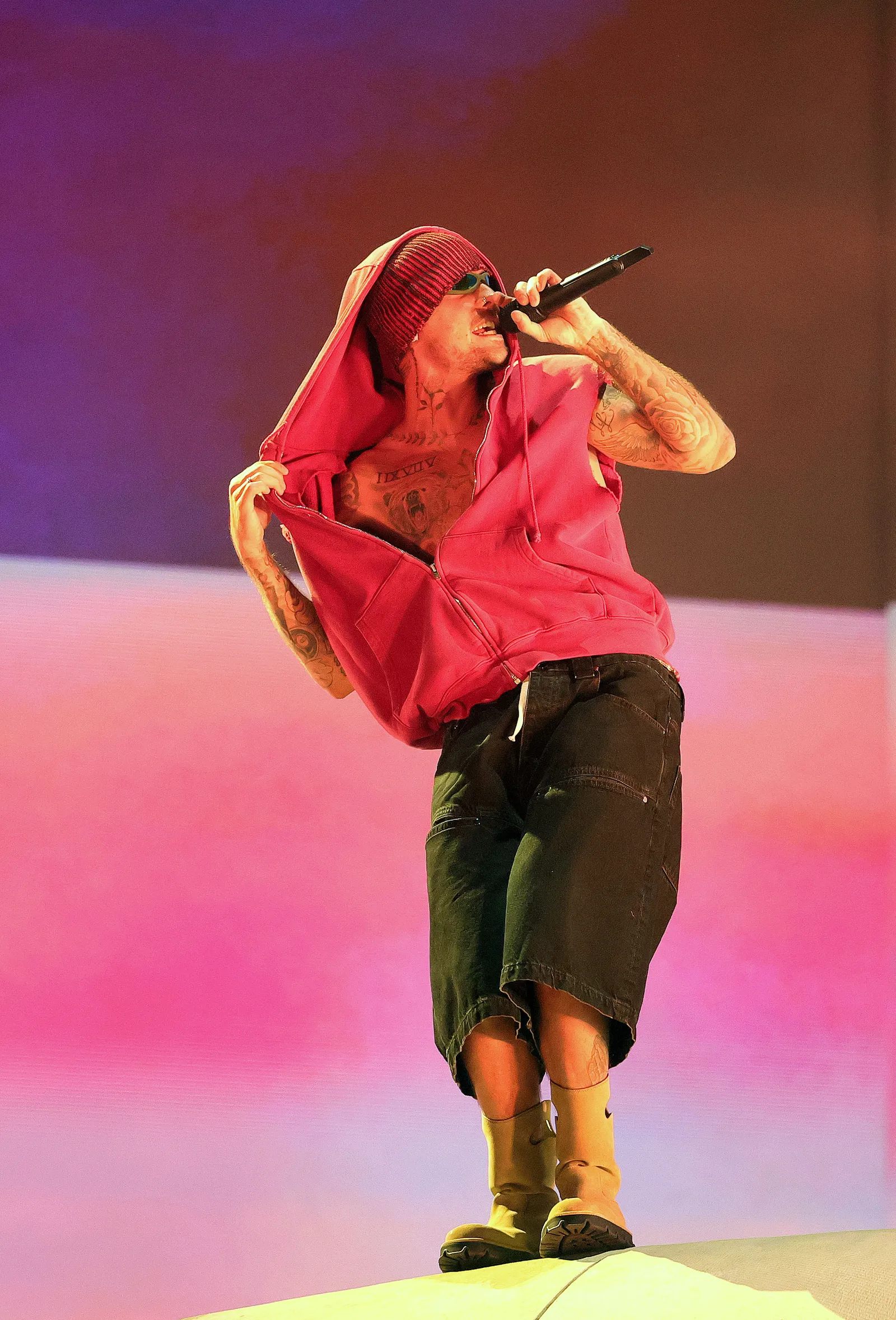 Image may contain Performer Person Solo Performance Adult Electrical Device and Microphone