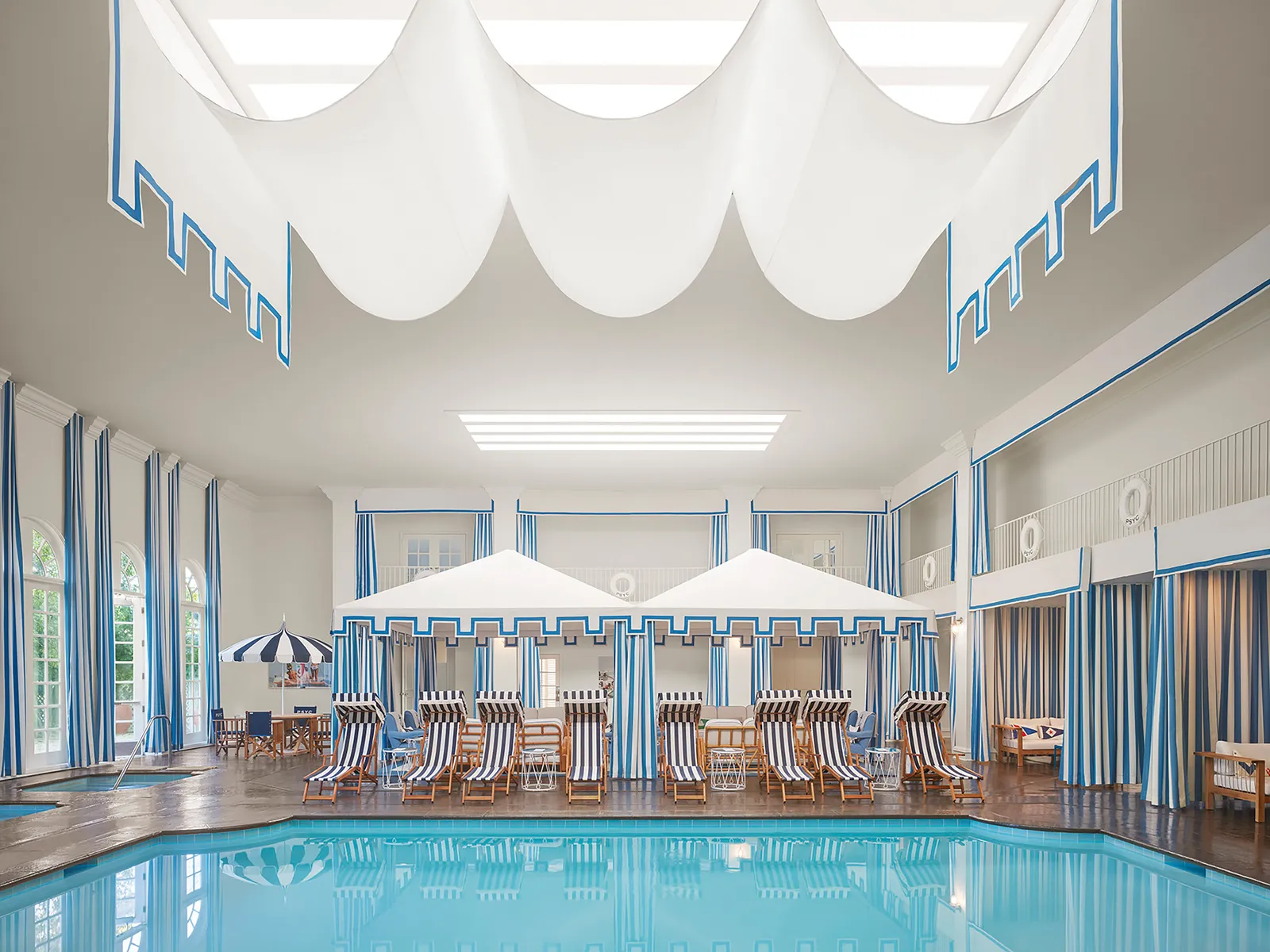 Image may contain Pool Water Swimming Pool Architecture Building Hotel Resort Chair and Furniture