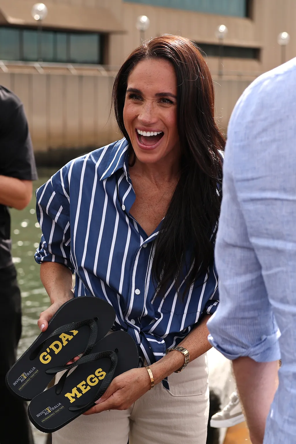 Image may contain Meghan Duchess of Sussex Head Person Face Happy Smile Laughing Adult Photography and Portrait
