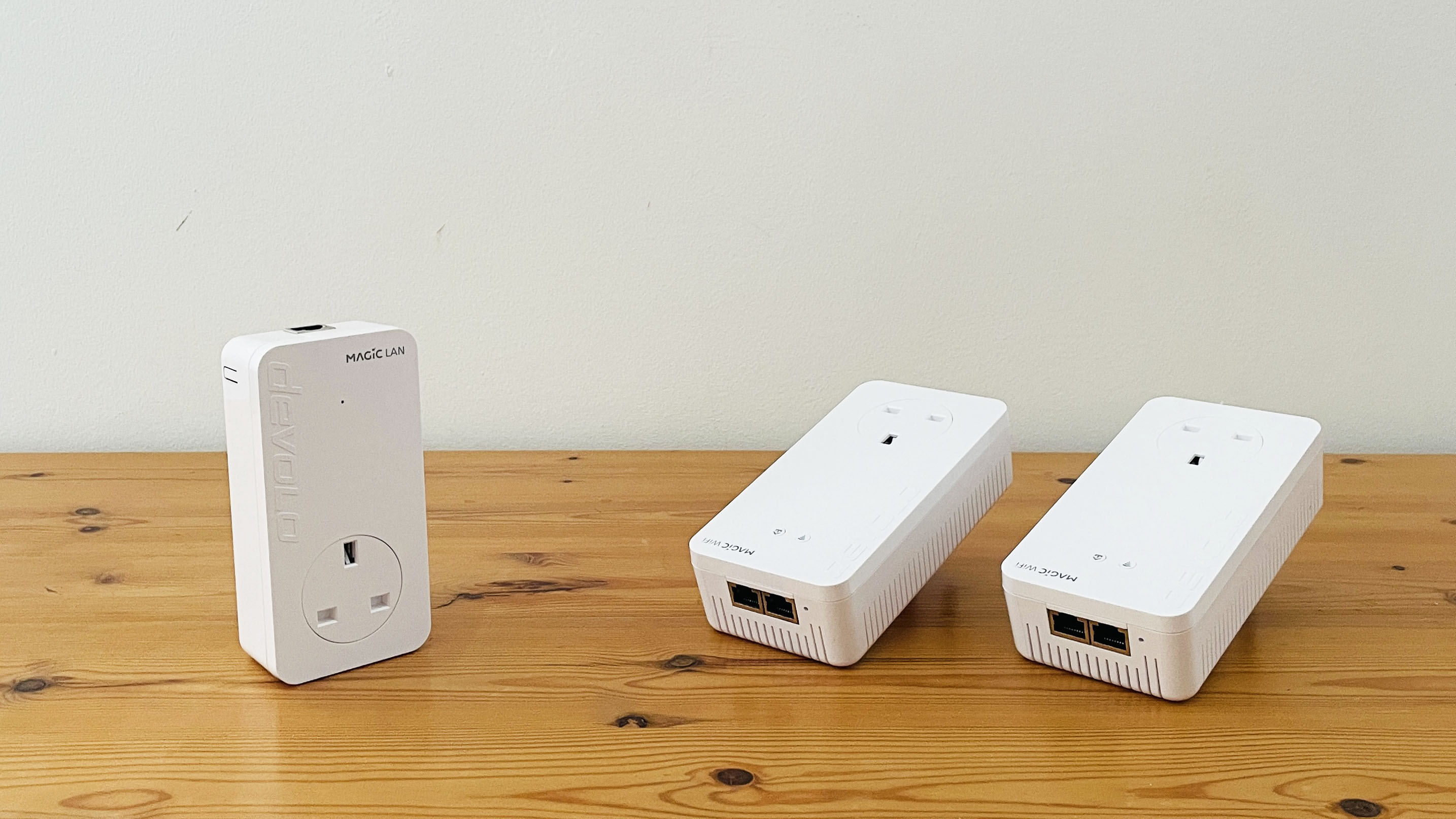 Devolo Magic 2 WiFi 6 next on wooden table