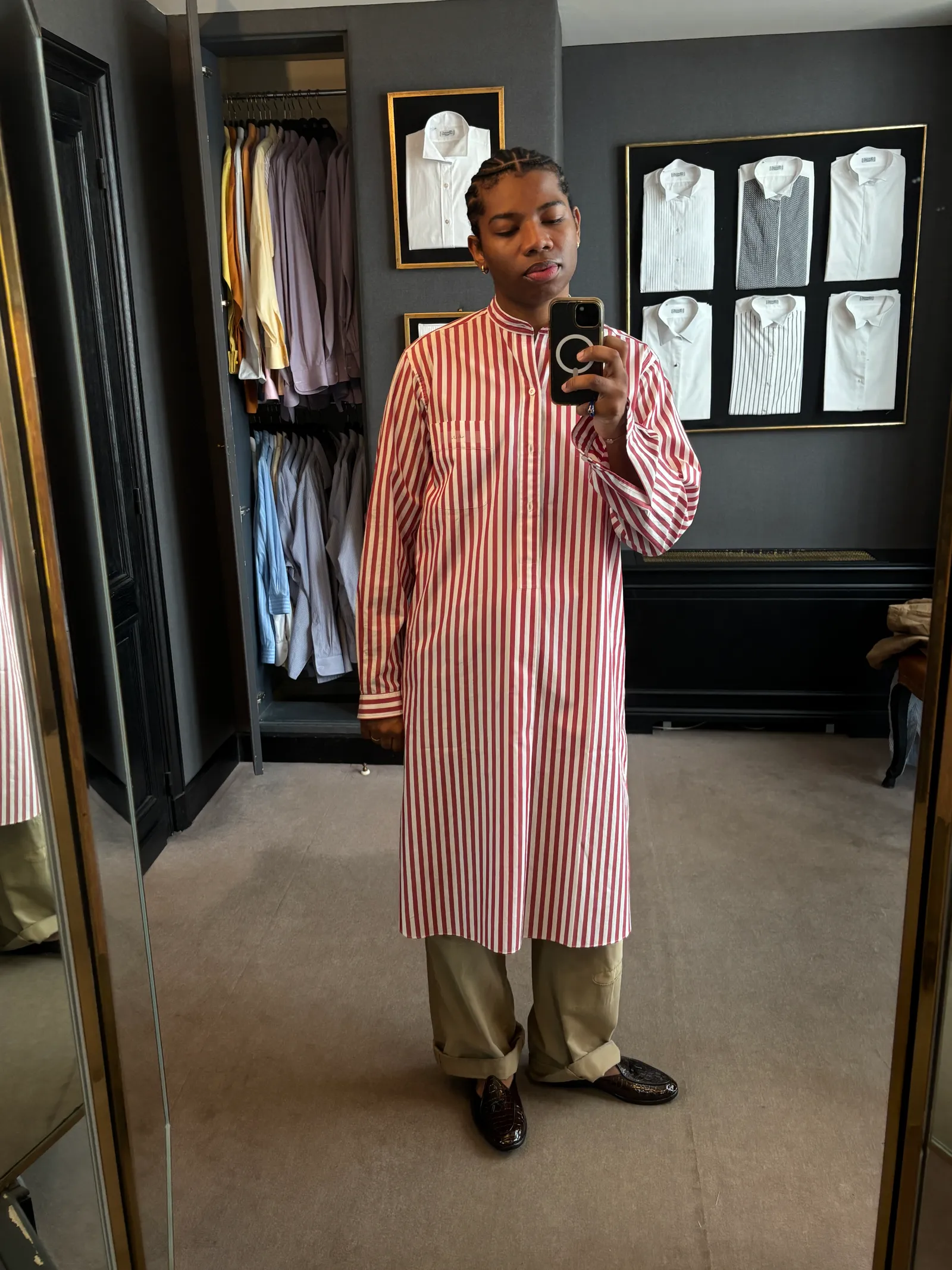 Image may contain Person Standing Clothing Coat Adult Indoors Face and Head