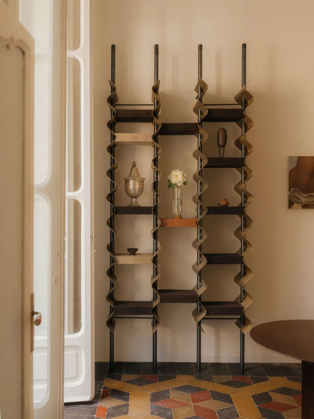 Image may contain Furniture Bookcase and Person