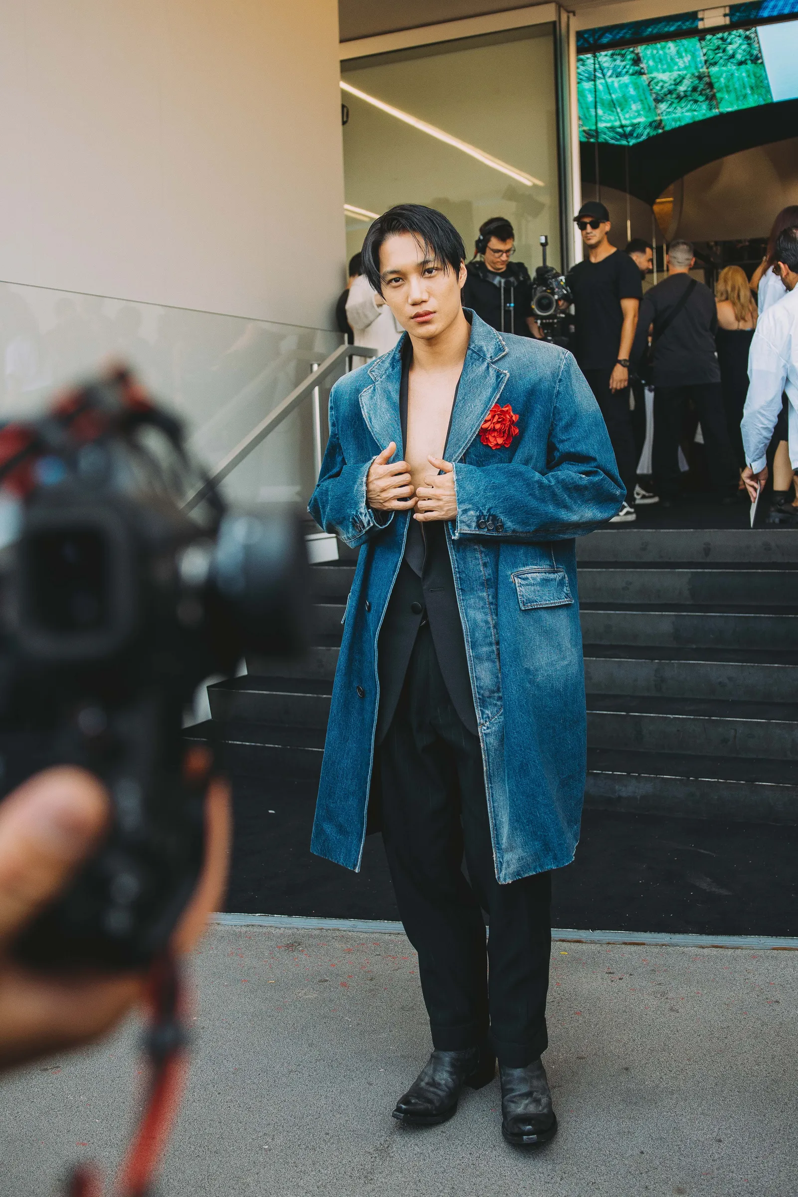 Image may contain Kai Clothing Coat Footwear Shoe Adult Person Face Happy Head Smile Hat and Standing
