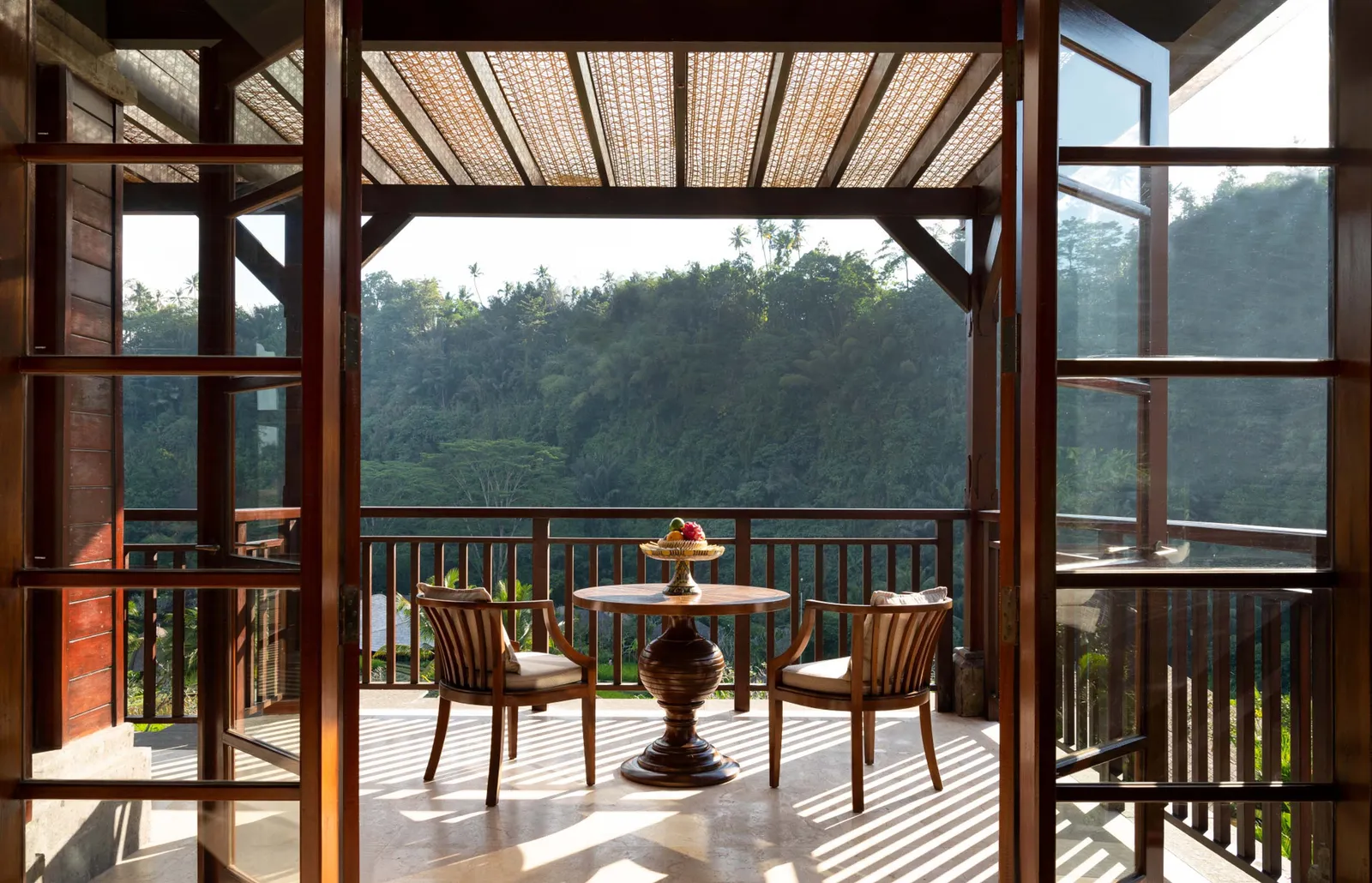 Image may contain Architecture Building Hotel Resort Chair Furniture Outdoors House Housing Porch Desk and Table